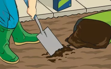 A person using Irish Moss peat as a top dressing on a piece of soil intended for lawn seed.