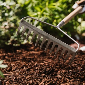 westland landscape bark being raked in border