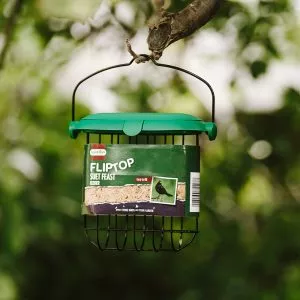 Flip Top Suet Feeder in packaging on tree