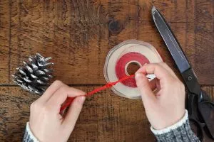 making a pinecone Christmas decoration