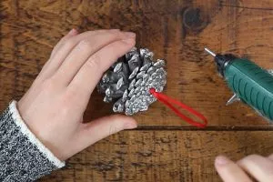 making a pinecone Christmas decoration