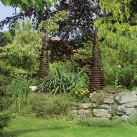 willow obelisks in garden