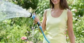 lady watering with spray gun