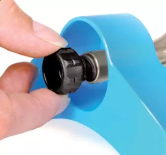 pulling out nozzle cleaning tool from sprinkler