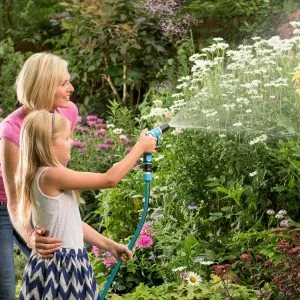 mother and daughter watering with vergo