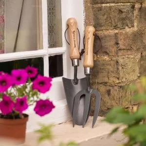 Carbon Steel Hand Fork and Trowel on window ledge