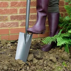 Kent & Stowe Carbon Steel Planting Spade in soil