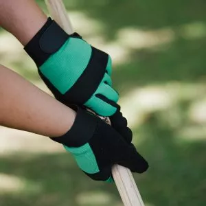 green flex protect gloves on tool