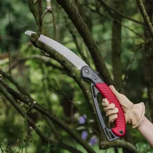 folding saw with hand guard in use