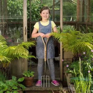 garden life lighter digging fork with young gardener