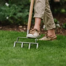 kent & stowe stainless steel lawn aerator in use