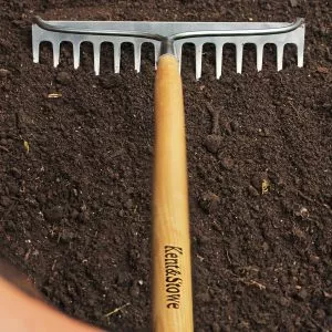 kent & stowe stainless steel long handled soil rake in use