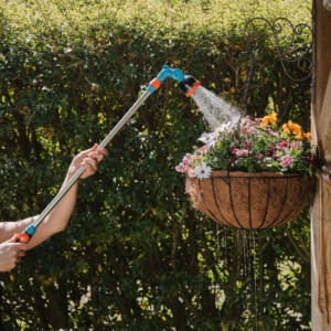 flopro telescopic watering lance in use watering hanging basket