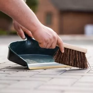 dustpan and brush in use