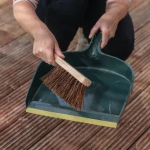 dustpan and brush in use