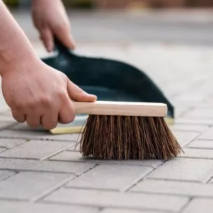 dustpan and brush in use