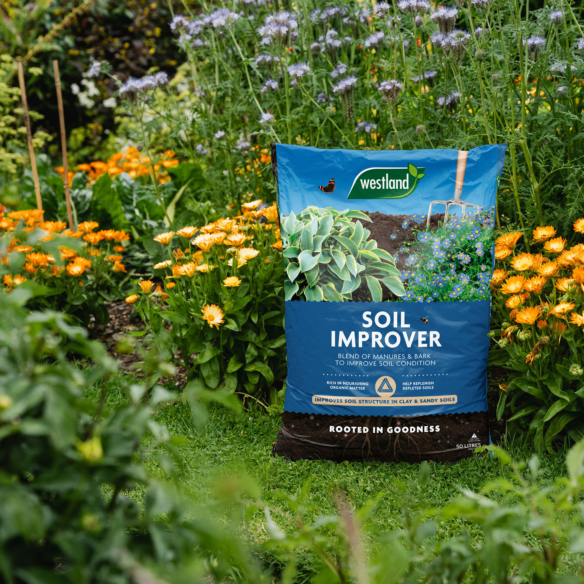 westland soil improver next to flower border