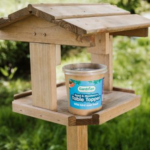 gardman seed & mealworm table topper on bird table