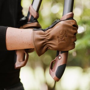 kent and stowe sure and soft leather gloves holding loppers